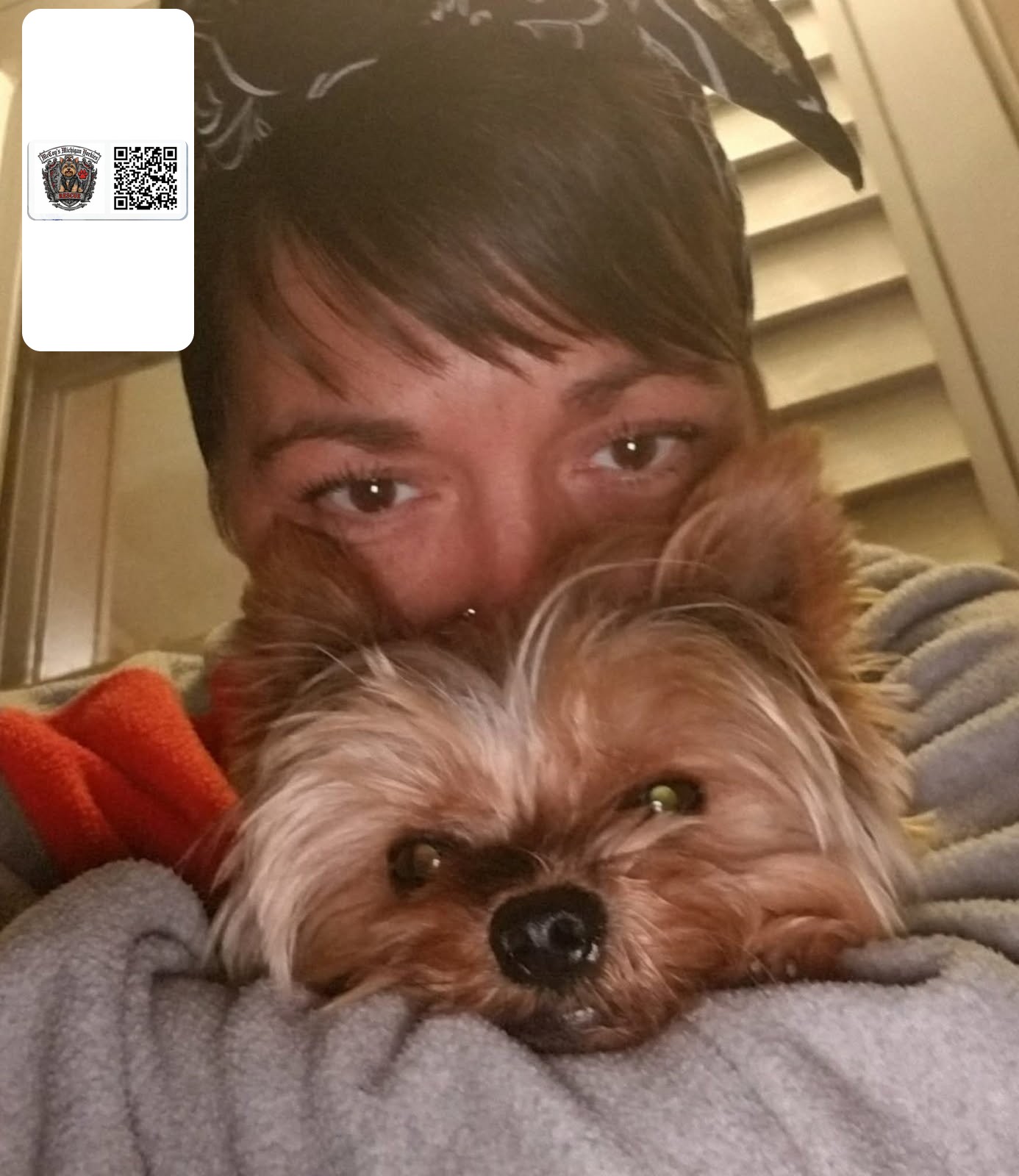 Crystal and Tucker, her Yorkshire Terrier, in a close cheek-to-cheek selfie